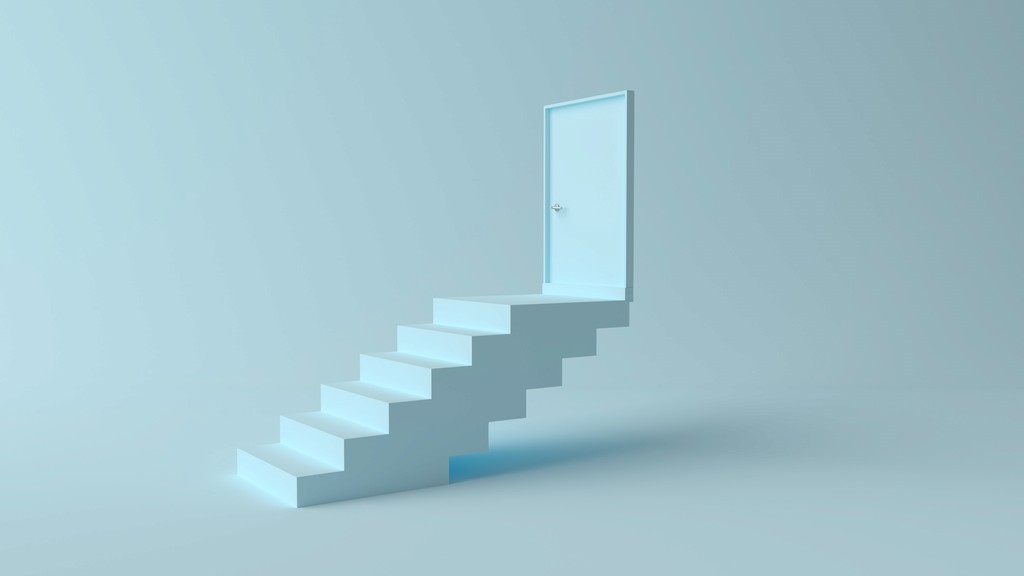 A staircase leading up to an open door